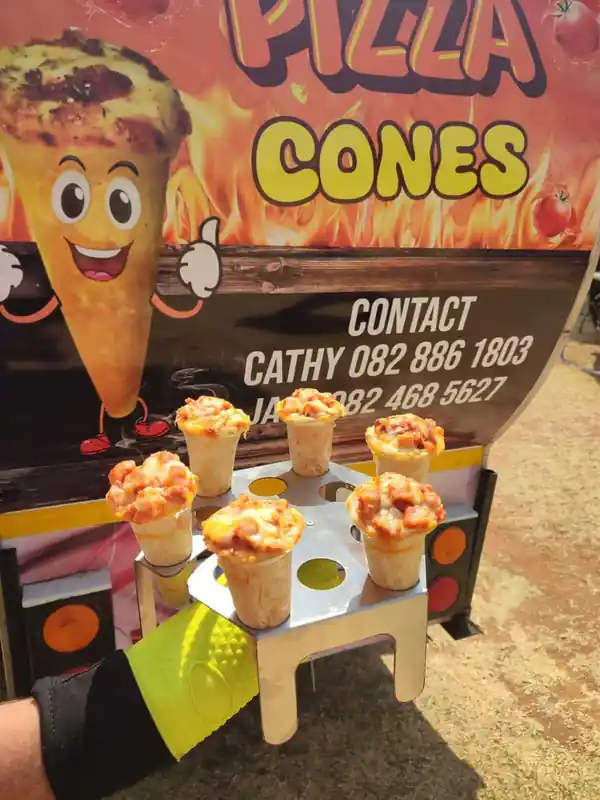 Fresh pizza cone filled with melted cheese